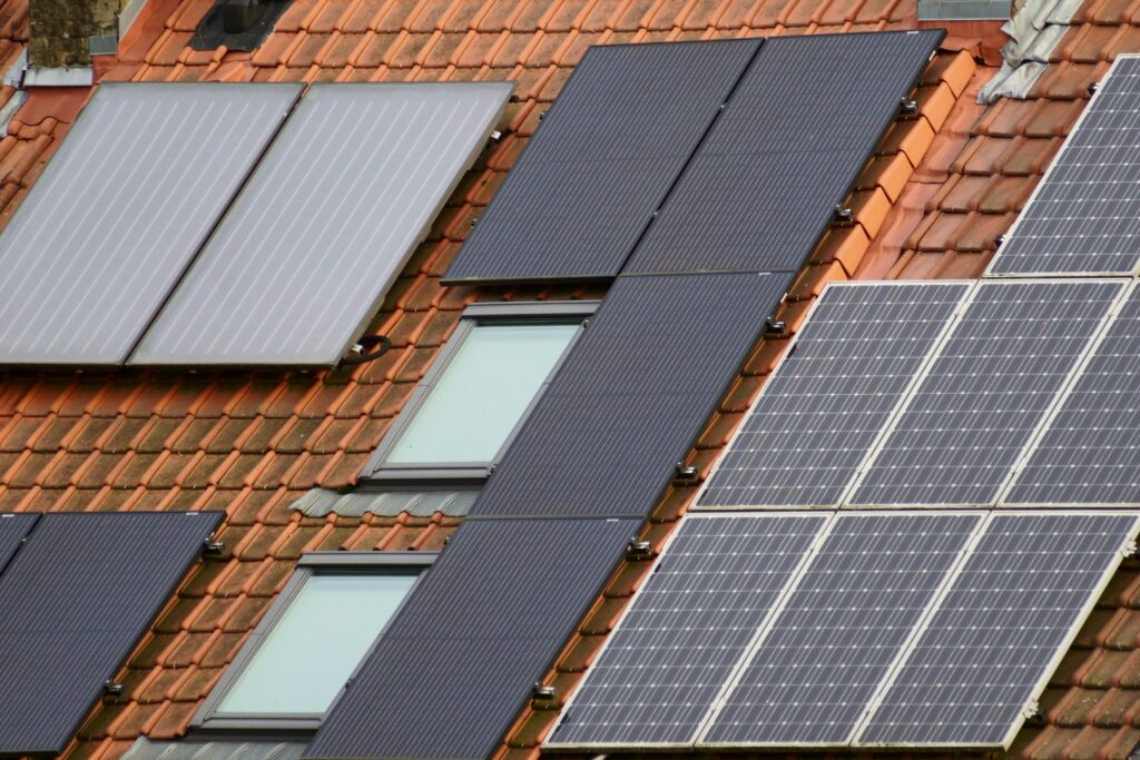 Close-up of solar panels on a tiled roof in Hyderabad, showcasing sustainable energy solutions.