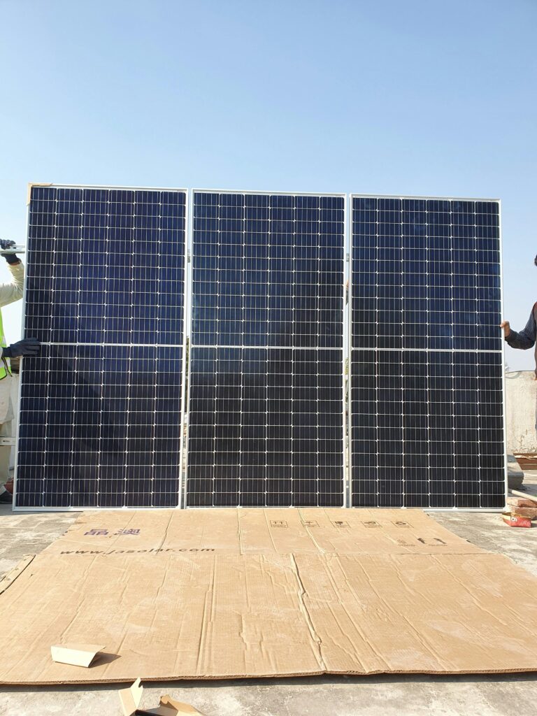 Rooftop solar system in Hyderabad under a clear sky representing sustainable energy.